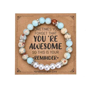 8mm zebra stone heart bracelet with pearls and crystals on a handmade reminder card