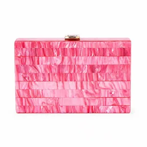 Chic pink and white marble striped acrylic clutch bag with a gold metal clasp for evening events