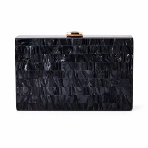 Elegant marble pattern acrylic clutch bag with golden metal clasp for evening events
