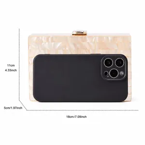 Detailed view of striped acrylic evening clutch with size reference for smartphone