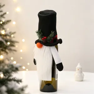 Detail of Christmas gnome wine bottle cover with black top hat and white plush beard