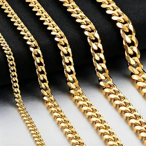 Detail view of five different widths of gold Cuban link chains in polished stainless steel