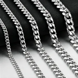 Macro detail of silver Cuban link chains in five different widths with metallic luster