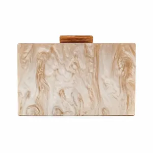 Close-up of marble texture acrylic evening clutch with rectangular clasp and hard shell