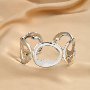 Macro shot of silver open cuff bracelet with irregular geometric hollow rings