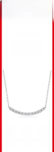 Macro detail of S925 sterling silver necklace featuring curved moissanite diamond row