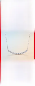 Detail of S925 sterling silver necklace featuring curved moissanite stones on a fine chain