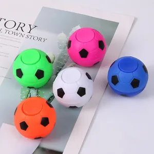 Five colorful soccer fidget spinners in green, pink, blue, orange, and white for kids