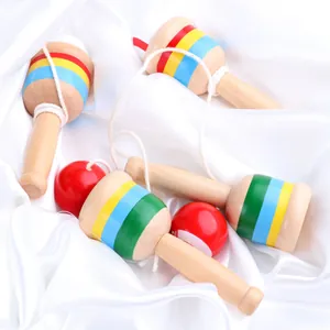 Set of four traditional wooden Kendama toys with colorful striped cups and red balls
