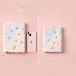 Size comparison of A5 and A6 rainbow plush notebooks with silver star patterns