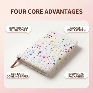 White plush notebook with colorful gold foil stars and brown silk bookmark ribbon