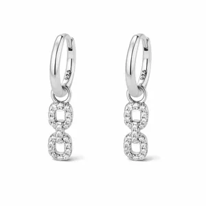 Detailed close-up of 925 sterling silver geometric drop earrings with sparkling pavé crystals