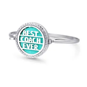 Detailed close-up of Best Coach Ever silver bangle with blue pad and sparkly rhinestones