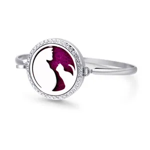 Detailed view of silver cat silhouette locket bracelet with purple felt and crystals