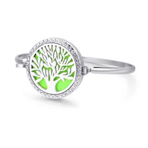 Close-up of tree of life aromatherapy diffuser locket bracelet with rhinestones