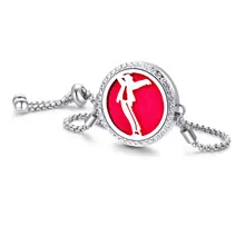 Detail of silver perfume diffuser bracelet with MJ silhouette and red background insert