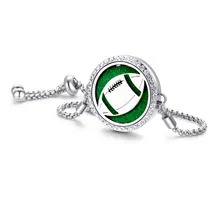 Macro detail of silver adjustable bracelet with green football charm and crystal accents