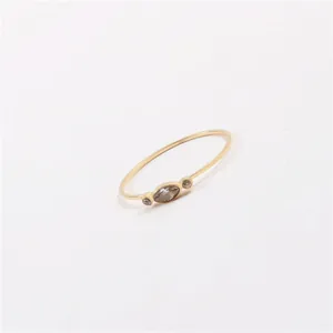 Minimalist ultra-thin gold ring featuring a marquise grey gemstone and side diamonds