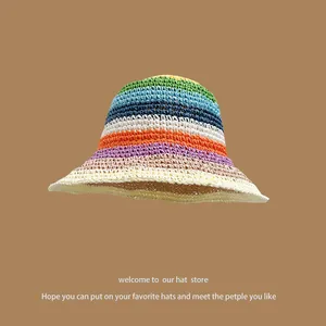 Macro detail of multi-color striped straw sun hat with premium woven texture