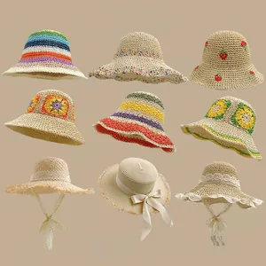 Collection of nine stylish summer straw hats with floral embroidery and lace ties