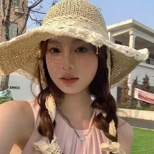 Elegant wide brim straw hat with lace floral trim for beach sun protection in summer