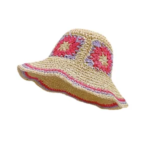 Handmade crochet straw hat with floral patterns and wide brim for summer sun protection