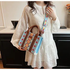 Close-up of bohemian canvas bag with ethnic patterns and adjustable wide shoulder strap