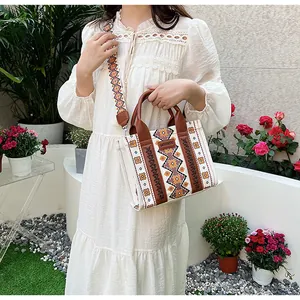 Close-up of Bohemian canvas tote bag with geometric patterns and leather handles