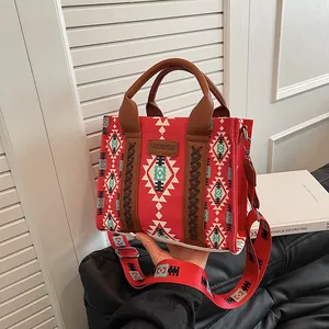 Ethnic style red canvas tote bag with geometric patterns and adjustable strap