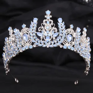 Elegant silver baroque bridal crown with blue crystal wheat ear design on black fabric