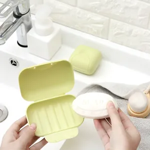 Portable light green travel soap dish with secure locking lid and drainage ridges