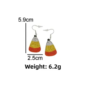 Detail of candy corn earrings with glitter finish, showing dimensions 5.9cm x 2.5cm
