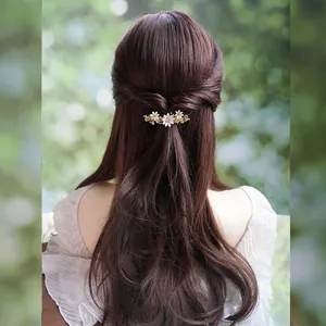 Elegant floral spring hair clip with white gradient petals and rhinestones in gold finish