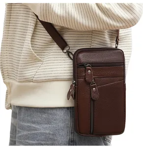 Detailed side view of deep brown leather crossbody bag with multi-zipper compartments