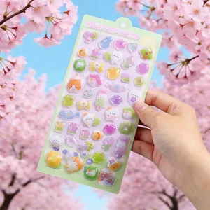 Detailed close-up of 3D embossed Japanese cartoon stickers on a cherry blossom background