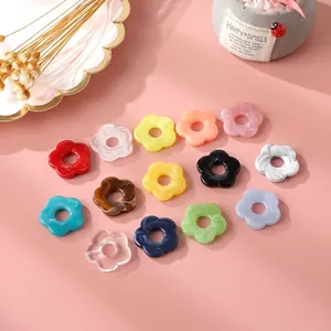 Colorful acrylic five-petal flower beads for DIY jewelry and crafts in flat lay view
