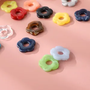 Close-up of colorful acrylic five-petal flower beads for DIY jewelry and accessories