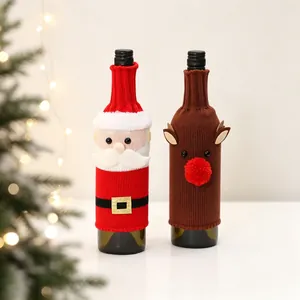 Detail of Christmas knitted wine bottle covers featuring Santa Claus and Reindeer designs