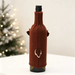 Detail of a brown knitted reindeer wine bottle cover with cute 3D ears and tail