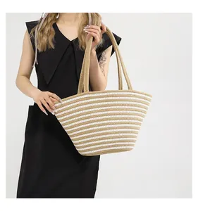 Detail of hand-woven striped tote bag with khaki and white cotton cord patterns