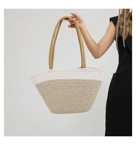 Detail of minimalist striped woven tote bag showing cotton texture and large capacity