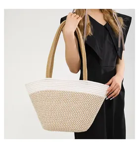 Detail of the high-density hand-woven cotton texture on a two-tone large tote bag