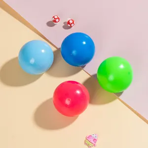 Colorful TPR squishy stress balls set on vibrant background with cute deco pieces