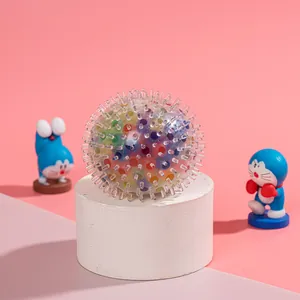 Macro detail of a soft spiky sensory stress ball filled with colorful water beads