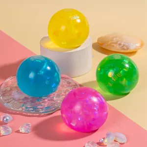 Macro shot of colorful glitter-filled stress balls on a decorative display stand