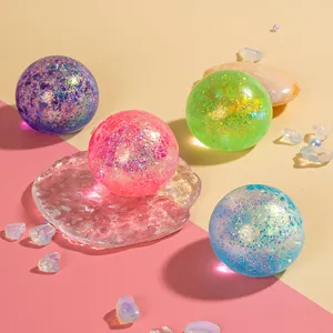 Set of four colorful glitter sensory stress balls in purple, pink, green and blue colors