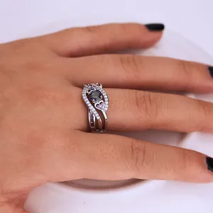 Silver twisted ring with purple amethyst, pink heart gem and pavé zircon on hand