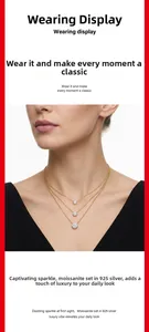 Detailed close-up of triple-layered 925 silver gold-plated necklaces with moissanite stones