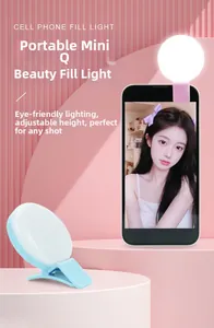 Macro detail of portable LED selfie ring light in pink and blue for smartphones