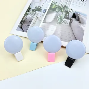 Portable mini LED ring light for smartphones in white, blue, pink and black colors